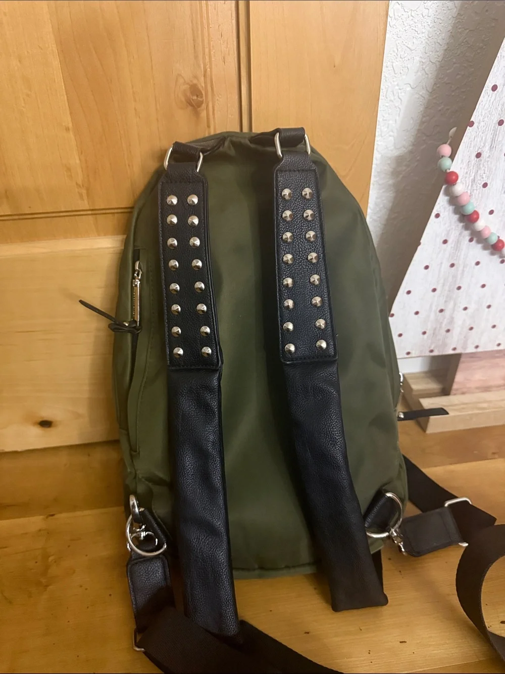 Steve Madden Olive Nylon Sling Backpack with Front Zip Pocket